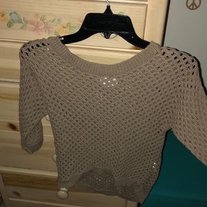 A tan/brown sweater